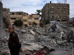 Neighbors inspect the rubble of the Hasouna family house, which was struck by an Israeli airstrike during an operation to rescue two hostages in Rafah, southern Gaza Strip, Tuesday, Feb. 13, 2024. Ibrahim Hasouna, who was away at the time of the airstrike, says his entire family was killed, including his parents, two brothers, his sister-in-law and three nieces and nephews. AP/PTI(AP02_14_2024_000001B) Neighbors inspect the rubble of the Hasouna family house, which was struck by an Israeli airstrike during an operation to rescue two hostages in Rafah, southern Gaza Strip, Tuesday, Feb. 13, 2024. Ibrahim Hasouna, who was away at the time of the airstrike, says his entire family was killed, including his parents, two brothers, his sister-in-law and three nieces and nephews. AP/PTI(AP02_14_2024_000001B)