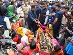 West Bengal Governor CV Ananda Bose with women protestors and others at Sandeshkhali block, in North 24 Parganas district, Monday, Feb. 12, 2024. Bose visited the trouble-torn block in the district on Monday and spoke to women protestors who alleged sexual harassment and torture by absconding TMC leader Shajahan Sheikh and his associates. 
