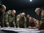 TOPSHOT - This handout photograph released on February 14, 2024 by the Press service of Ukrainian Armed Forces, shows Commander-in-Chief of the Armed Forces of Ukraine Oleksandr Syrsky (2nd L) and Ukraine's Defence Minister Rustem Umerov (L) visiting the frontline positions at an undisclosed location in eastern Ukraine. Newly appointed Ukrainian military chief said on February 14, 2024 that the situation on the front line was precarious, following a visit to positions near Avdiivka and Kupiansk. (Photo by Handout / Armed Forces of Ukraine / AFP) 
