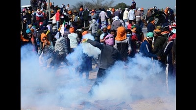 A protester throw the tear gas shell back during the protest at the Shambu Border of Punjab and Haryana border on Wednesday. (Ravi Kumar/HT) A protester throw the tear gas shell back during the protest at the Shambu Border of Punjab and Haryana border on Wednesday. (Ravi Kumar/HT)