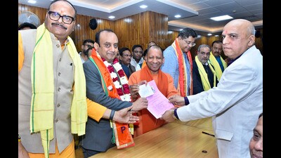 BJP candidate Sudhansu Trivedi files his nomination papers for the Rajya Sabha elections, at the UP Assembly, in Lucknow, on Wednesday. (Deepak Gupta Hindustan Times) BJP candidate Sudhansu Trivedi files his nomination papers for the Rajya Sabha elections, at the UP Assembly, in Lucknow, on Wednesday. (Deepak Gupta Hindustan Times)