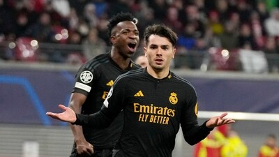 Real Madrid's Brahim Diaz celebrates in front of after he scored the opening goal during the Champions League round of 16 first leg vs RB Leipzig (AP) Real Madrid's Brahim Diaz celebrates in front of after he scored the opening goal during the Champions League round of 16 first leg vs RB Leipzig (AP)