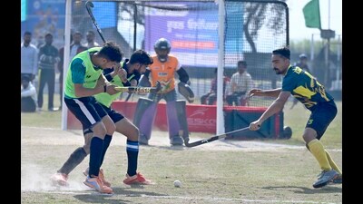 Hockey players in action during the 84th Rural Olympics at Kila Raipur village in Ludhiana on Wednesday. (Gurpreet Singh/HT) Hockey players in action during the 84th Rural Olympics at Kila Raipur village in Ludhiana on Wednesday. (Gurpreet Singh/HT)