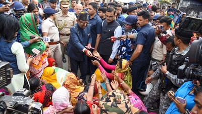 West Bengal Governor CV Ananda Bose with women protestors and others at Sandeshkhali block, in North 24 Parganas district, Monday, Feb. 12, 2024. Bose visited the trouble-torn block in the district on Monday and spoke to women protestors who alleged sexual harassment and torture by absconding TMC leader Shajahan Sheikh and his associates. (PTI) West Bengal Governor CV Ananda Bose with women protestors and others at Sandeshkhali block, in North 24 Parganas district, Monday, Feb. 12, 2024. Bose visited the trouble-torn block in the district on Monday and spoke to women protestors who alleged sexual harassment and torture by absconding TMC leader Shajahan Sheikh and his associates. (PTI)