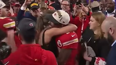 A video shows Taylor Swift embracing Mecole Hardman as people celebrated on the field (KMBC 9 screenshot/YouTube) A video shows Taylor Swift embracing Mecole Hardman as people celebrated on the field (KMBC 9 screenshot/YouTube)