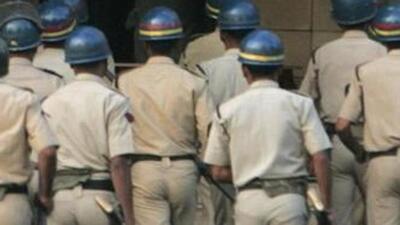 The police post in-charge was seen throwing away bottles of liquor and roasted chicken into the adjacent field (HT File)