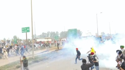 Police use tear gas to disperse protesting farmers gathered at the Punjab-Haryana Shambhu border during the second day of their 'Delhi Chalo' march, near Ambala, Wednesday, (PTI) Police use tear gas to disperse protesting farmers gathered at the Punjab-Haryana Shambhu border during the second day of their 'Delhi Chalo' march, near Ambala, Wednesday, (PTI)