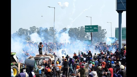 Haryana Police fires tear gas shells to stop protesters at Shambu Border on Wednesday. (Ravi Kumar/HT)
