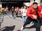 People flee after shots were fired near the Kansas City Chiefs' Super Bowl LVIII victory parade on February 14, 2024, in Kansas City, Missouri. (Photo by ANDREW CABALLERO-REYNOLDS / AFP)