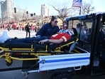 A victim is aided after shots were fired near the Kansas City Chiefs' Super Bowl LVIII victory parade on February 14, 2024, in Kansas City, Missouri. (Photo by ANDREW CABALLERO-REYNOLDS / AFP) A victim is aided after shots were fired near the Kansas City Chiefs' Super Bowl LVIII victory parade on February 14, 2024, in Kansas City, Missouri. (Photo by ANDREW CABALLERO-REYNOLDS / AFP)