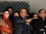 Pakistan's former Prime Minister Nawaz Sharif (C) and leader of the Pakistan Muslim League (PML) party, along with his younger brother and former prime minister Shehbaz Sharif (R) and his daughter Maryam Nawaz (L) speaks with supporters in Lahore on February 9, 2024.