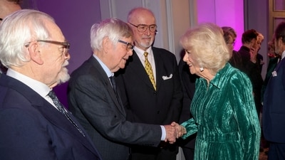 Britain Queen Camilla shakes hands with Tom Courtenay with Brian Cox (L) and Peter Egan (C) as she attends the Celebration Of Shakespeare at Grosvenor House in London on February 14, 2024. Camilla, who wore a green velvet dress, met actors, authors and directors at the celebration, also joining guests for group photographs. (via REUTERS)