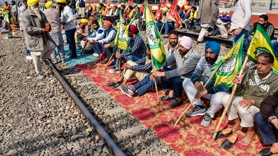 Farmers initiated their protest around noon by occupying rail tracks at various locations. The demonstrations are expected to persist until 4 pm. (PTI) Farmers initiated their protest around noon by occupying rail tracks at various locations. The demonstrations are expected to persist until 4 pm. (PTI)