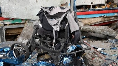 This photo released by Belgorod region governor Vyacheslav Gladkov's telegram channel on Thursday, Feb. 15, 2024, shows a baby stroller broken during shelling next to a damaged shopping mall in Belgorod, Russia. Officials say a missile strike hit the Russian city of Belgorod near the Ukraine border in what appears to be the latest exchange of long-range missile and rocket fire between the two countries. (via AP) This photo released by Belgorod region governor Vyacheslav Gladkov's telegram channel on Thursday, Feb. 15, 2024, shows a baby stroller broken during shelling next to a damaged shopping mall in Belgorod, Russia. Officials say a missile strike hit the Russian city of Belgorod near the Ukraine border in what appears to be the latest exchange of long-range missile and rocket fire between the two countries. (via AP)