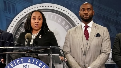 Fulton County District Attorney Fani Willis speaks at a press conference next to prosecutor Nathan Wade after a Grand Jury brought back indictments against former president Donald Trump and his allies in their attempt to overturn the state's 2020 election results, in Atlanta, Georgia, U.S. August 14, 2023. REUTERS/Elijah Nouvelage/File Photo (REUTERS)