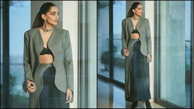 Sonam's outfit is from the shelves of clothing brand Maryam Al Omaira and features a black bralette, a grey blazer with full sleeves and a chic uneven pattern for a trendy vibe. She paired it with a blue pleated skirt featuring the attached grey fabric on the side, which matched her blazer and added an oomph factor to her look. (Instagram/@sonamkapoor)