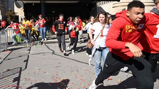 People flee after shots were fired near the Kansas City Chiefs' Super Bowl LVIII victory parade on February 14, 2024, in Kansas City, Missouri. (Photo by ANDREW CABALLERO-REYNOLDS / AFP) (AFP)