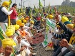 Farmers block the railway tracks in Amritsar on Thursday as they continue their 'Delhi Chalo' protest march demanding a law guaranteeing MSP for crops. 