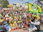 Members of the farm union Bharatiya Kisan Union (Ekta Ugrahan) block railway tracks during a protest to demand minimum crop prices at a railway station in Rajpura. 