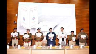(From left) UT DGP Praveer Ranjan, UT adviser Rajeev Verma, home secretary Nitin Kumar Yadav and SSP Kanwardeep Kaur during the launch of ‘Investigation Officer’s Handbook’ and mobile app ‘Learn New Bharatiya Laws’ at Sector 9, Chandigarh, on Friday. (HT Photo)
