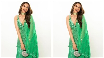 Assisted by celebrity fashion stylist Anshika Verma, Rakul accessorised her look with a gold choker necklace embellished with green emeralds, matching stud statement earrings, a gold bracelet adorning her wrist and a silver mini bag that perfectly complemented her stunning look. (Instagram/@rakulpreet) Assisted by celebrity fashion stylist Anshika Verma, Rakul accessorised her look with a gold choker necklace embellished with green emeralds, matching stud statement earrings, a gold bracelet adorning her wrist and a silver mini bag that perfectly complemented her stunning look. (Instagram/@rakulpreet)
