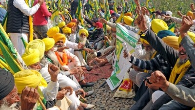 Farmers block the railway tracks in Amritsar on Thursday as they continue their 'Delhi Chalo' protest march demanding a law guaranteeing MSP for crops. (ANI) Farmers block the railway tracks in Amritsar on Thursday as they continue their 'Delhi Chalo' protest march demanding a law guaranteeing MSP for crops. (ANI)