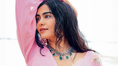 Adah Sharma is wearing a pink organza saree with a full-sleeve puff blouse and a statement diamond and emerald neckpiece from Naulakha Jewellers (Photo: Smriti Jha) Adah Sharma is wearing a pink organza saree with a full-sleeve puff blouse and a statement diamond and emerald neckpiece from Naulakha Jewellers (Photo: Smriti Jha)