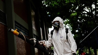 Brazil Dengue Outbreak: A health worker sprays insecticide to kill the Aedes aegypti mosquito to help mitigate a dengue outbreak, at the Nova Betania School in Brasilia, Brazil. (Reuters)