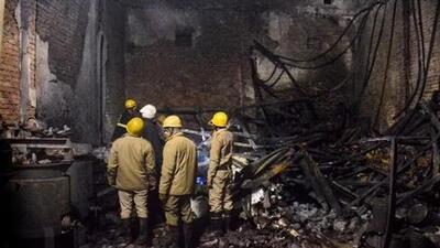Fire brigade personnel look on after dousing a late fire at a paint factory in the Alipur area in northern New Delhi on February 16. (AP) Fire brigade personnel look on after dousing a late fire at a paint factory in the Alipur area in northern New Delhi on February 16. (AP)