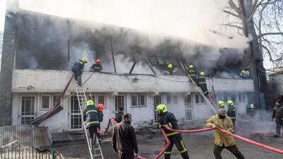 Firefighters trying to douse the blaze that broke out at the MLA hostel in Srinagar. (ANI)