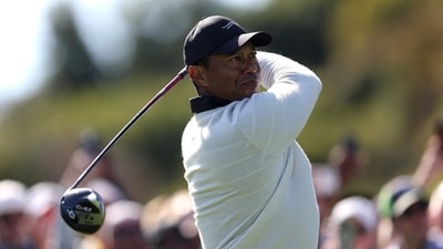 =Tiger Woods of the United States tees off the 18th hole during the first round of The Genesis Invitational at Riviera Country Club (Getty Images via AFP)