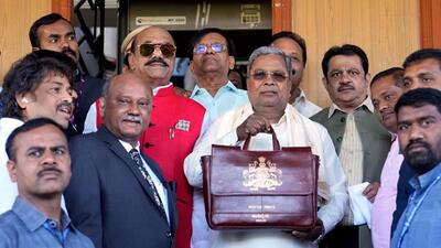 Karnataka chief minster Siddaramaiah with a bag containing budget papers arrived at Vidhana Soudha, in Bengaluru on Friday (PTI) Karnataka chief minster Siddaramaiah with a bag containing budget papers arrived at Vidhana Soudha, in Bengaluru on Friday (PTI)