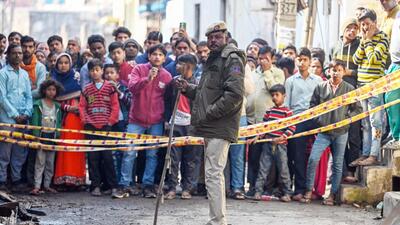 New Delhi, India - February 16, 2024: Locals gathered near the paint godown that caught fire last night, resulting in the death of 11 people in Alipur, in New Delhi on Friday, February 16, 2024. (Photo by Raj K Raj/Hindustan Times) (Hindustan Times) New Delhi, India - February 16, 2024: Locals gathered near the paint godown that caught fire last night, resulting in the death of 11 people in Alipur, in New Delhi on Friday, February 16, 2024. (Photo by Raj K Raj/Hindustan Times) (Hindustan Times)