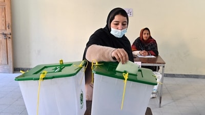 A woman cast her ballot at a polling station during Pakistan's national elections in Islamabad on February 8. (AFP) A woman cast her ballot at a polling station during Pakistan's national elections in Islamabad on February 8. (AFP)