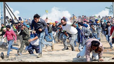 Protesters run for cover after cops fired tear-gas shells at Shambhu border on Friday. (Ravi Kumar/Ht) Protesters run for cover after cops fired tear-gas shells at Shambhu border on Friday. (Ravi Kumar/Ht)