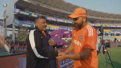 Sarfaraz Khan's father Nuashad with India captain Rohit Sharma
