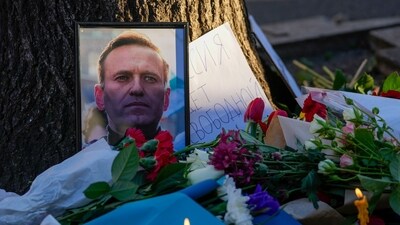A portrait of opposition leader Alexei Navalny and flowers are seen during a protest in front of Russian embassy in Belgrade, Serbia. (AP) A portrait of opposition leader Alexei Navalny and flowers are seen during a protest in front of Russian embassy in Belgrade, Serbia. (AP)