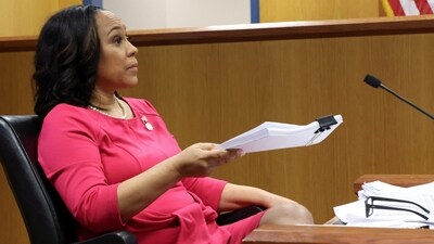 Attorney Fani Willis speaks while holding documents during a hearing in the case of State of Georgia v. Donald John Trump at the Fulton County Courthouse in Atlanta, Georgia, U.S., February 15, 2024. (REUTERS)