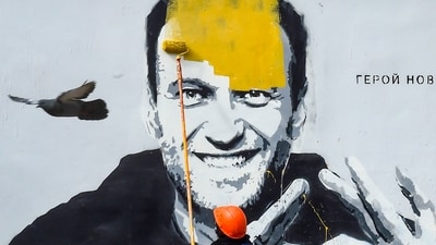 Alexei Navalny dies: A worker paints over graffiti of jailed Kremlin critic Alexei Navalny in Saint Petersburg. (AFP) Alexei Navalny dies: A worker paints over graffiti of jailed Kremlin critic Alexei Navalny in Saint Petersburg. (AFP)