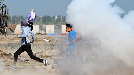 Bharat Bandh LIVE Updates: Security personnel fire tear gas shots to disburse protesters who try to remove barricades at the Shambhu border of Punjab/Haryana near Ambala during the Farmers protest on Friday, February 16, 2024.Photo by Ravi Kumar/ Hindustan Times. Bharat Bandh LIVE Updates: Security personnel fire tear gas shots to disburse protesters who try to remove barricades at the Shambhu border of Punjab/Haryana near Ambala during the Farmers protest on Friday, February 16, 2024.Photo by Ravi Kumar/ Hindustan Times.
