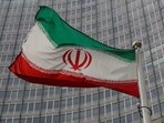 An Iranian flag flutters.
