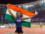 India's Jyothi Yarraji celebrates after winning silver medal in the women's 100-meter hurdles final event at the 19th Asian Games, in Hangzhou