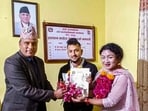 Maya Gurung and Surendra Pandey receive their marriage certificate after legally registering same-sex marriage, at Dordi Rural Municipality of Lamjung district in Western Nepal. Nepal registered the first female-female same-sex marriage, between Anju Devi Shrestha and Suprita Gurung in Bardiya district