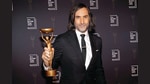 Paul Lynch, Winner of the 2023 Booker Prize for Prophet Song poses for the media with his trophy following the presentation ceremony in London on November 26, 2023. (AP Photo/Alberto Pezzali)