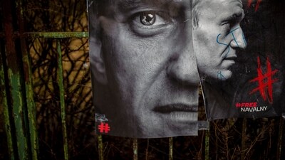 Photos of Alexei Navalny hang on the fence at the monument to the victims of soviet occupation in Vilnius, Lithuani. (AP) Photos of Alexei Navalny hang on the fence at the monument to the victims of soviet occupation in Vilnius, Lithuani. (AP)