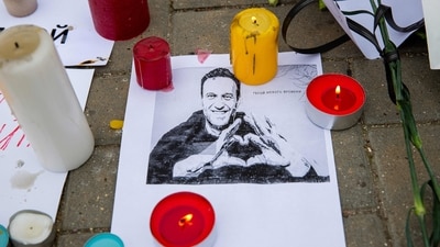 Candles surround a portrait of Alexei Navalny at Russian embassy in Chisinau on February 17, 2024, one day after Russian officials announced the death of the Kremlin's most prominent critic. Russian officials announced the 47-year-old had died on February 16 in an Arctic prison, a month before an election poised to extend President Vladimir Putin's hold on power. (Photo by Elena COVALENCO / AFP) (AFP) Candles surround a portrait of Alexei Navalny at Russian embassy in Chisinau on February 17, 2024, one day after Russian officials announced the death of the Kremlin's most prominent critic. Russian officials announced the 47-year-old had died on February 16 in an Arctic prison, a month before an election poised to extend President Vladimir Putin's hold on power. (Photo by Elena COVALENCO / AFP) (AFP)
