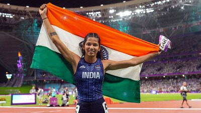 India's Jyothi Yarraji celebrates after winning silver medal in the women's 100-meter hurdles final event at the 19th Asian Games, in Hangzhou (PTI)
