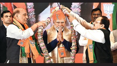 Prime Minister Narendra Modi with defence minister Rajnath Singh and BJP president JP Nadda at Bharat Mandapam on Saturday. (Arvind Yadav/HT Photo) Prime Minister Narendra Modi with defence minister Rajnath Singh and BJP president JP Nadda at Bharat Mandapam on Saturday. (Arvind Yadav/HT Photo)