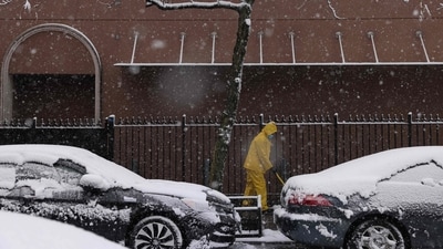 A person shovels the sidewalk as snow falls in the Brooklyn borough of New York City on February 13, 2024. Heavy snowfall is expected over parts of the Northeast US starting late February 12, with some areas getting up to two inches (5cms) of snow an hour, the National Weather Service forecasters said. (Photo by Yuki IWAMURA / AFP) (AFP) A person shovels the sidewalk as snow falls in the Brooklyn borough of New York City on February 13, 2024. Heavy snowfall is expected over parts of the Northeast US starting late February 12, with some areas getting up to two inches (5cms) of snow an hour, the National Weather Service forecasters said. (Photo by Yuki IWAMURA / AFP) (AFP)