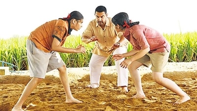 Suhani Bhatnagar (left) with Aamir Khan and Zaira Wasim in a still from Dangal. Suhani Bhatnagar (left) with Aamir Khan and Zaira Wasim in a still from Dangal.